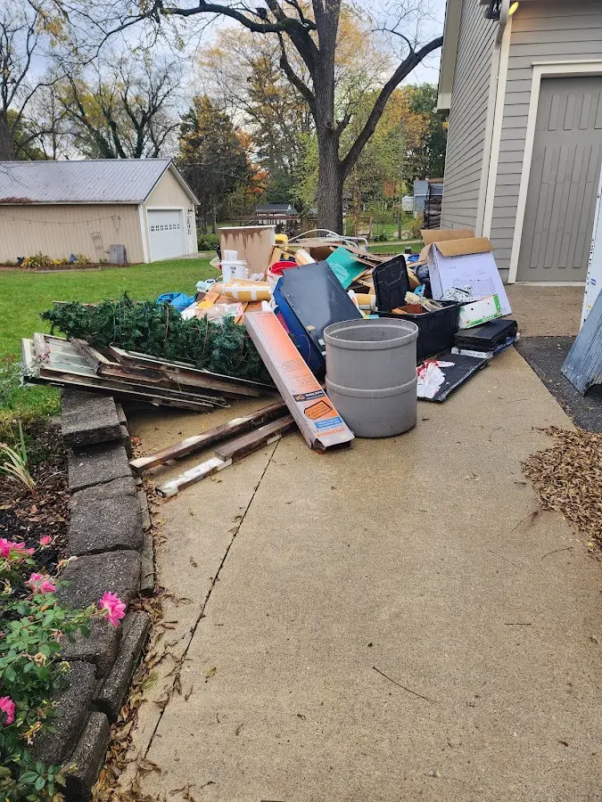 Dumpster being loaded with debris for Residential Dumpster Rental in Storm Lake